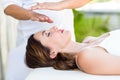 Calm woman receiving reiki treatment Royalty Free Stock Photo