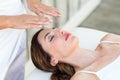 Calm woman receiving reiki treatment Royalty Free Stock Photo