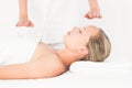 Calm woman receiving reiki treatment Royalty Free Stock Photo