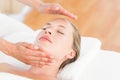 Calm woman receiving reiki treatment Royalty Free Stock Photo