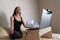 Calm woman relaxing meditating with laptop, no stress free relief at work concept, mindful peaceful young businesswoman Royalty Free Stock Photo