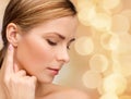 Calm woman touching her ear Royalty Free Stock Photo