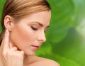 Calm woman touching her ear Royalty Free Stock Photo