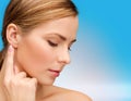 Calm woman touching her ear Royalty Free Stock Photo