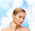 Calm woman touching her ear Royalty Free Stock Photo