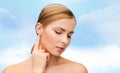 Calm woman touching her ear Royalty Free Stock Photo