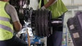 Calm workers controlling aircraft machine and chassis. Aircraft maintenance mechanic inspects plane chassis. Installing Royalty Free Stock Photo