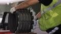 Calm workers controlling aircraft machine and chassis. Aircraft maintenance mechanic inspects plane chassis. Installing Royalty Free Stock Photo