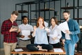 Calm young business woman meditate at business meeting avoiding pressure annoying angry colleagues. Royalty Free Stock Photo