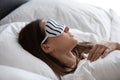 Calm young female sleeping in cozy bed at home Royalty Free Stock Photo