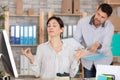 calm young woman doing yoga exercise at workplace Royalty Free Stock Photo