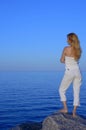 Calm young woman looking at the sea Royalty Free Stock Photo