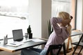 Calm young woman relax at desk at home office Royalty Free Stock Photo