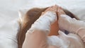 Calm young woman sleeping well in comfortable cozy bed on white soft pillows linen and waking up in the morning,insomnia Royalty Free Stock Photo