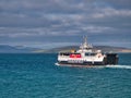 The CalMac Caledonian MacBrayne roro ferry MV Loch Alainn leaves the Eriskay Ferry Terminal in the Outer Hebrides, Scotland, UK Royalty Free Stock Photo