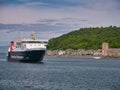 The CalMac operated roro car ferry MV Lord of the Isles passes the Corran Esplanade in Oban, Scotland, UK. Taken on a calm day Royalty Free Stock Photo