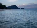 Calmful ocean beach dusk with deep blue sky and breezing waves in Kanom, Thailand