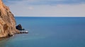 Calming ocean water. Nude beach. Seascape panorama. Virgin nature. Summer vacation. Freedom and relaxation. Sharp cliff. Royalty Free Stock Photo