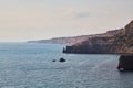 Calming ocean water. Nude beach. Seascape panorama. Virgin nature. Summer vacation. Freedom and relaxation. Sharp cliff. Royalty Free Stock Photo