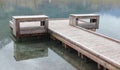 A calming and peaceful bench, overlooking the mountain refection on the water