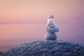 Calming zen rock stack by a lake