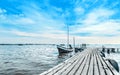 Calmness lake shore with small fishing boat