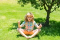 Calmness and relax. Mindfulness meditation. Relaxed boy with closed eyes on nature. Summer dream. Kid dreams on grass Royalty Free Stock Photo