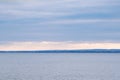 Calmness water and cloud skies above seascape. Royalty Free Stock Photo