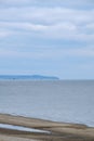 Calmness water and cloud skies above seascape. Royalty Free Stock Photo