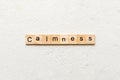 calmness word written on wood block. calmness text on cement table for your desing, concept