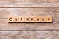 Calmness word written on wood block. calmness text on wooden table for your desing, concept