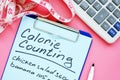Calorie counting list for weight loss on desk Royalty Free Stock Photo