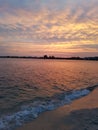 Caloundra sunset shores froth on the sand