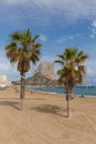 Calp Costa Blanca Alicante Spain with beach, palm trees and Penon de Ilfach rock