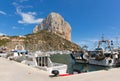 Calp Spain marina with boats and famous rock landmark
