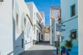 Calpe, Spain - April 14, 2023: View to cozzy empty streets with colorful houses, restaurants, bar terraces in Calpe Royalty Free Stock Photo