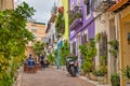 Street in the old town of Calpe with colorful houses and restaurant terraces, Alicante, Spain.