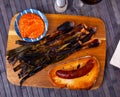 Calsot, romesco, butifarra on dining table