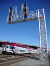 Caltrain locomotive races by rail crossing along track