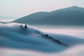 Calvary over clouds in Banska Stiavnica, Slovakia Royalty Free Stock Photo