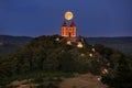 Calvary under the moonlight in the night. Illuminated historical monument. Shining moon.