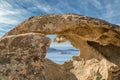 Calvi in Corsica viewed through hole in rock Royalty Free Stock Photo