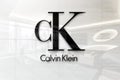 Calvin klein on glossy office wall realistic texture