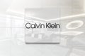 Calvin klein on glossy office wall realistic texture