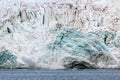 Calving ice of a massive glacier at Svalbard Royalty Free Stock Photo