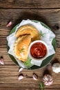 Calzone pizza stuffed with ham, ricotta, salami, cheese and mushrooms Royalty Free Stock Photo