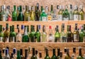 Cam Ranh, Khanh Hoa Province, Vietnam - July 14, 2019: Tops of empty glass bottles of various types of alcohol are visible on