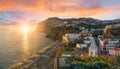 Camara de Lobos village at sunset, Cabo Girao in background, Madeira island Royalty Free Stock Photo