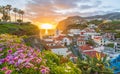 Camara de Lobos village at sunset, Cabo Girao in background, Madeira island, Portugal Royalty Free Stock Photo