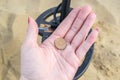 CAMBER SANDS, ENGLAND- 18 September 2021: A found penny whilst metal detecting on Camber Sands beach Royalty Free Stock Photo